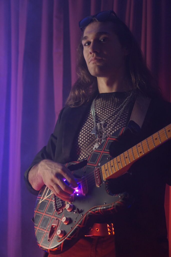 Andrew Brooks and his guitar, "Chaos"